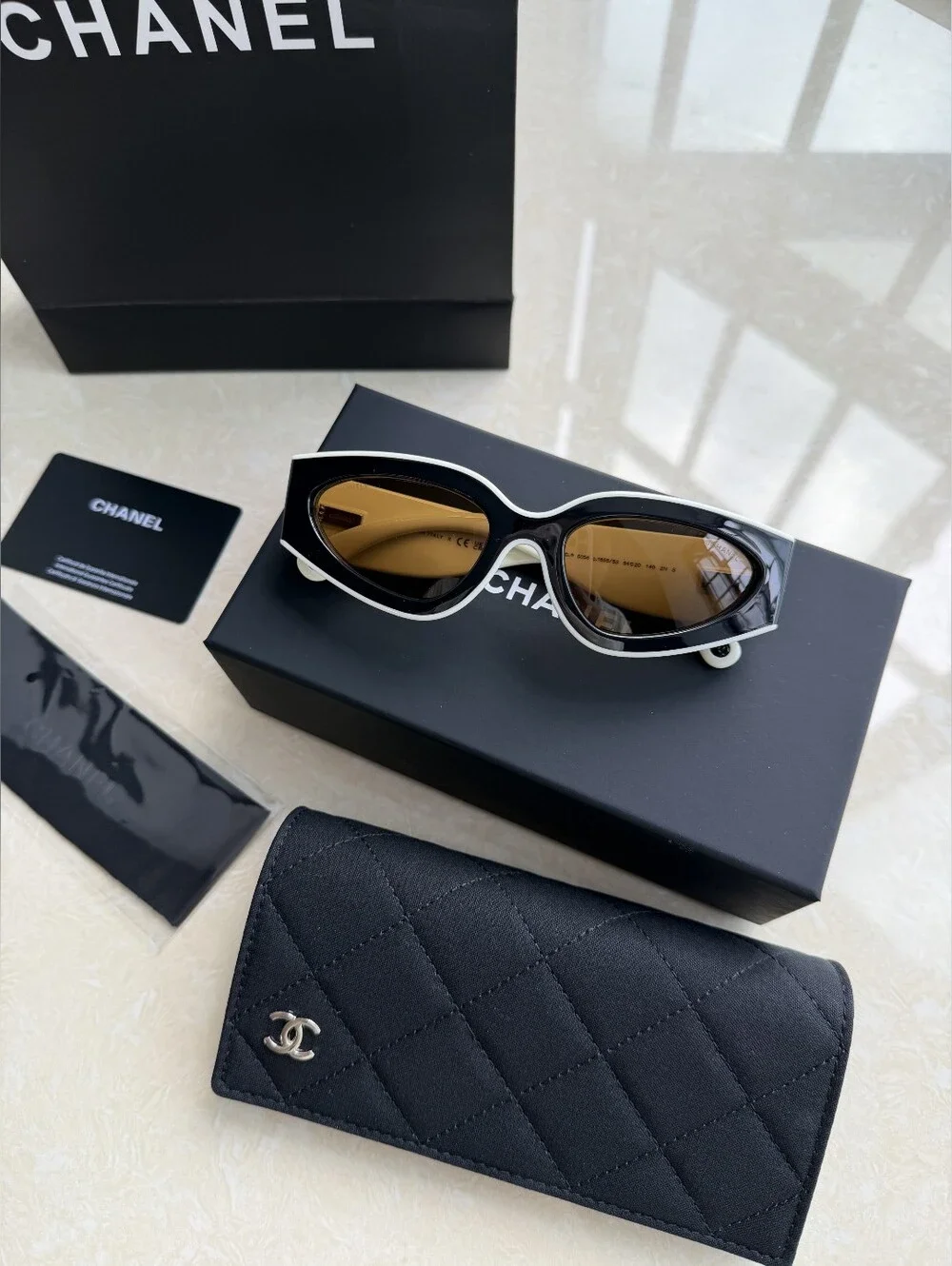 CHANEL Black and White Cat-Eye Sunglasses with Brown Lenses